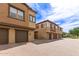 Beautiful townhouse with a paved driveway and two-car garage doors at 14870 W Encanto Blvd # 2138, Goodyear, AZ 85395