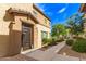 Inviting front entrance with well-maintained landscaping and a modern brown door at 14870 W Encanto Blvd # 2138, Goodyear, AZ 85395
