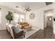 Cozy living room with hardwood floors, a comfortable sofa, and large windows at 14870 W Encanto Blvd # 2138, Goodyear, AZ 85395