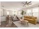 Bright and airy living room featuring hardwood floors, modern furniture, and ample natural light at 14870 W Encanto Blvd # 2138, Goodyear, AZ 85395