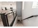 Carpeted staircase with metal and dark wood railing, with views of the kitchen at 14870 W Encanto Blvd # 2138, Goodyear, AZ 85395