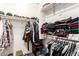 Functional walk-in closet featuring rods, shelves and room for storing clothes and personal items at 14870 W Encanto Blvd # 2138, Goodyear, AZ 85395