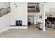 Bright living room featuring modern fireplace, hardwood floors, with a view of the upper level at 15027 N 19Th Way, Phoenix, AZ 85022