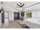 Bright primary bedroom with vaulted ceiling, large windows, hardwood floors, and a canopy bed at 15027 N 19Th Way, Phoenix, AZ 85022
