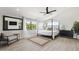 Bright primary bedroom features large windows, hardwood floors, and a canopy bed at 15027 N 19Th Way, Phoenix, AZ 85022