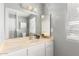 Bathroom with white cabinets, marble countertop, and a well-lit mirror, offering a clean, functional space at 1756 N Summer Cir, Mesa, AZ 85203