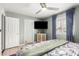 Bedroom with a mounted television and an ensuite closet at 1756 N Summer Cir, Mesa, AZ 85203