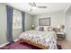 Bedroom with blue curtains and a brightly patterned bed at 1756 N Summer Cir, Mesa, AZ 85203