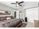 Bedroom with a ceiling fan and an ensuite closet at 1756 N Summer Cir, Mesa, AZ 85203