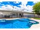 Beautiful backyard pool with a built-in table, complemented by the home's exterior and a secure safety fence at 1756 N Summer Cir, Mesa, AZ 85203