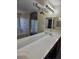 Bathroom with double sink vanity with large mirror and decorative decal at 1794 N Agave St, Casa Grande, AZ 85122