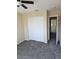 Bedroom featuring neutral walls, plush carpeting, closet and an open doorway to another room at 1794 N Agave St, Casa Grande, AZ 85122