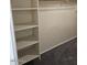 Functional walk-in closet with built-in shelving and a hanging rod at 1794 N Agave St, Casa Grande, AZ 85122