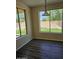 Cozy dining area with natural light and views to the yard, featuring wood-look floors at 1794 N Agave St, Casa Grande, AZ 85122