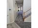 Entryway with carpeted floors, security system and access to the living room at 1794 N Agave St, Casa Grande, AZ 85122