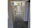 Neutral hallway with carpet flooring, doorways to other rooms, and light and bright interior at 1794 N Agave St, Casa Grande, AZ 85122