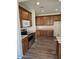 Well-equipped kitchen with wooden cabinets, stainless steel appliances, and ample counter space at 1794 N Agave St, Casa Grande, AZ 85122