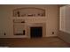 Bright living room with a decorative fireplace mantel, recessed lighting, and a window with blinds at 1794 N Agave St, Casa Grande, AZ 85122