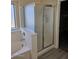 Modern bathroom with separate shower, tub and tile floors at 1794 N Agave St, Casa Grande, AZ 85122