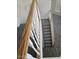 Carpeted staircase with decorative white railing leading to the upper level at 1794 N Agave St, Casa Grande, AZ 85122
