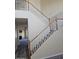 Carpeted staircase with decorative white railing leading to the upper level at 1794 N Agave St, Casa Grande, AZ 85122