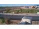 Community street view of a green space with walking path and nearby homes at 1794 N Agave St, Casa Grande, AZ 85122