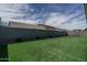 The backyard has artificial turf and a block wall at 18731 W San Juan Ave, Litchfield Park, AZ 85340