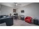 Bedroom features a desk area, accent chair, and a modern ceiling fan at 18731 W San Juan Ave, Litchfield Park, AZ 85340