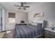Comfortable bedroom with a ceiling fan, window, and desk area creating a functional space at 18731 W San Juan Ave, Litchfield Park, AZ 85340