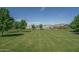 A wide open green space in the community with grass, trees and nice landscaping at 18731 W San Juan Ave, Litchfield Park, AZ 85340