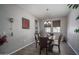 Inviting dining room featuring a chandelier and a large window allowing natural light at 18731 W San Juan Ave, Litchfield Park, AZ 85340