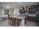 Stylish kitchen with a large island, bar seating, and ample storage; perfect for entertaining at 18731 W San Juan Ave, Litchfield Park, AZ 85340