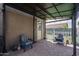 A cozy patio with pavers, comfortable seating, and a shade cover for relaxing outdoors at 18731 W San Juan Ave, Litchfield Park, AZ 85340
