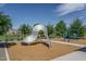 Community playground featuring climbing structure and swings for outdoor fun at 18731 W San Juan Ave, Litchfield Park, AZ 85340