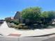 View of the home's landscaping and sidewalk along a quiet street at 18731 W San Juan Ave, Litchfield Park, AZ 85340