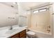 Bright bathroom features a shower-tub combo with neutral tile surround, a single sink, and neutral wall color at 1944 N Lazona Dr, Mesa, AZ 85203