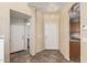 Bright foyer features neutral tile floors and direct access to a conveniently located powder room at 1944 N Lazona Dr, Mesa, AZ 85203