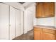 Hallway area features cabinets and closet for storage at 1944 N Lazona Dr, Mesa, AZ 85203
