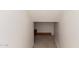 A unique storage space with neutral carpeting and white walls offers a functional area for organization and storage at 1944 N Lazona Dr, Mesa, AZ 85203