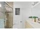 Bright bathroom featuring a glass shower, modern artwork and vanity at 2229 N Middlecoff Dr, Mesa, AZ 85215