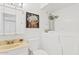 Charming bathroom with unique vanity, floral art and accessible tub at 2229 N Middlecoff Dr, Mesa, AZ 85215