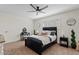 Cozy bedroom with a ceiling fan, a vanity table, and modern decor at 2229 N Middlecoff Dr, Mesa, AZ 85215