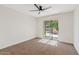 Bedroom with access to the backyard through sliding glass doors at 2229 N Middlecoff Dr, Mesa, AZ 85215