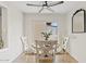 Cozy dining area featuring tile floors, a round table with chairs, and natural light at 2229 N Middlecoff Dr, Mesa, AZ 85215