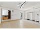 Bright and spacious garage with ample storage shelving and room for parking and projects at 2229 N Middlecoff Dr, Mesa, AZ 85215