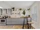 Well-lit kitchen with butcher block counters, stainless steel appliances, modern shelving, and a breakfast table at 2229 N Middlecoff Dr, Mesa, AZ 85215