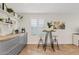 Bright kitchen featuring butcher block countertops, stainless appliances, a breakfast table, and modern shelving at 2229 N Middlecoff Dr, Mesa, AZ 85215