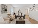 Comfortable living room with stylish furniture, decor, plantation shutters, and a decorative rug at 2229 N Middlecoff Dr, Mesa, AZ 85215
