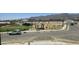 Community park featuring green lawn and seating area with mountain backdrop at 22392 W Monona Ln, Surprise, AZ 85387