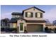 Two-story home featuring stucco and stone accents, a front-facing two car garage, and professionally landscaped yard at 22392 W Monona Ln, Surprise, AZ 85387